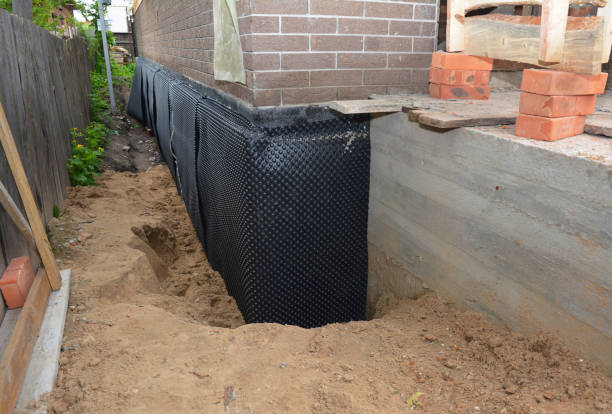 Happy homeowners after waterproofing job in Dixon Springs